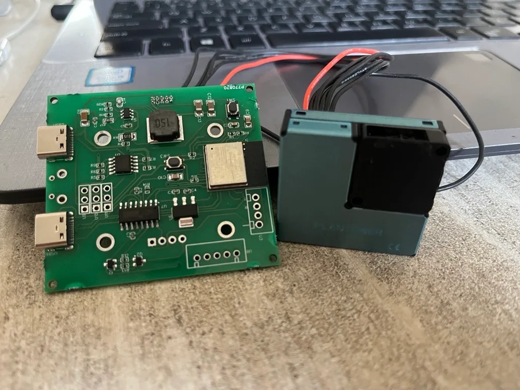 Custom DigitalMonk PCB alongside Plantower particulate matter sensor for the air quality monitor