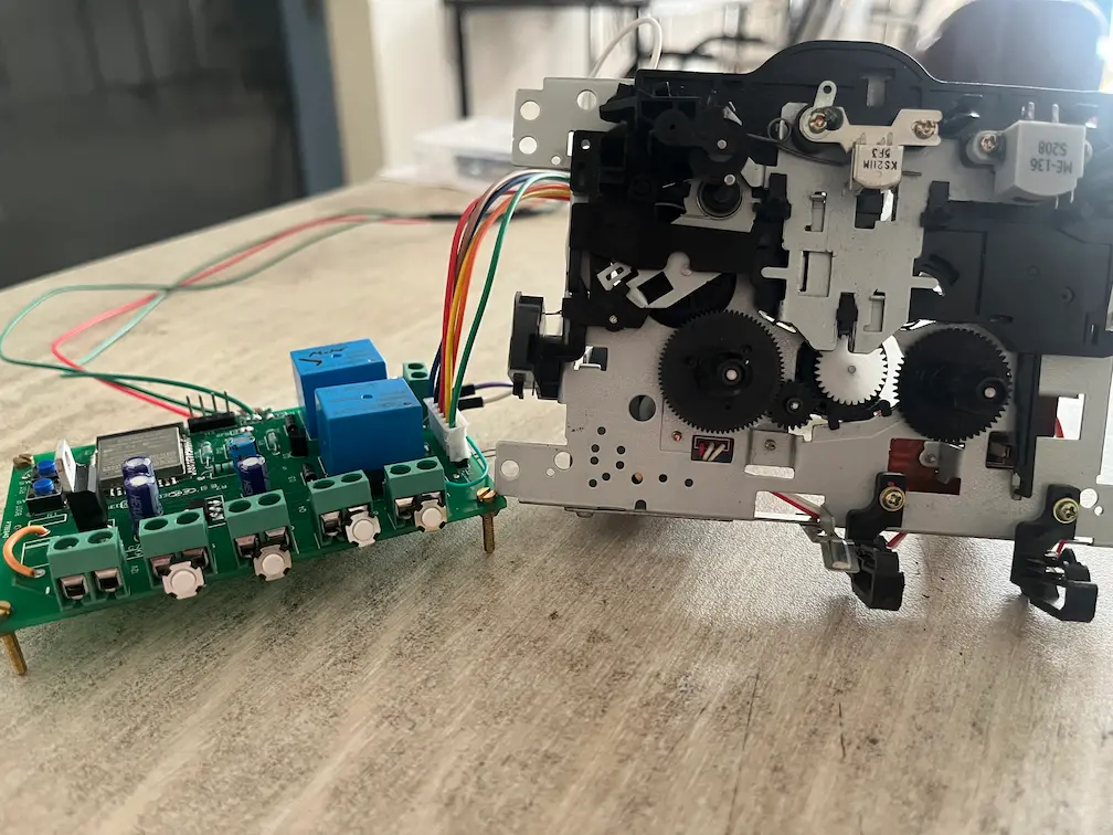 Side profile of the custom ESP32 PCB wired to the cassette deck mechanism
