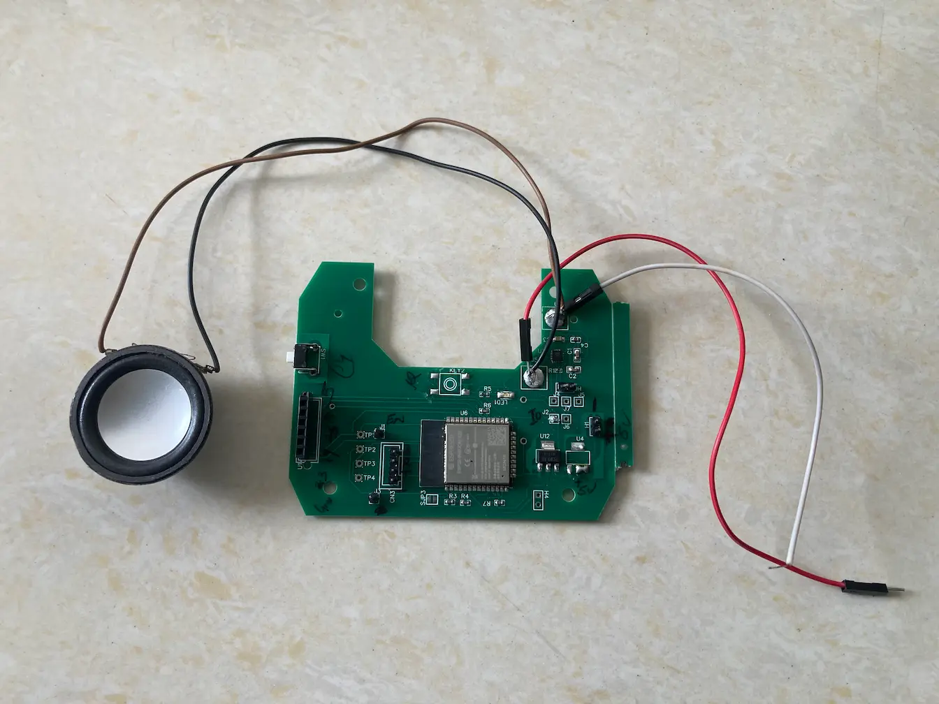 Custom ESP32-WROOM-32E PCB and speaker for the Bible Button audio player