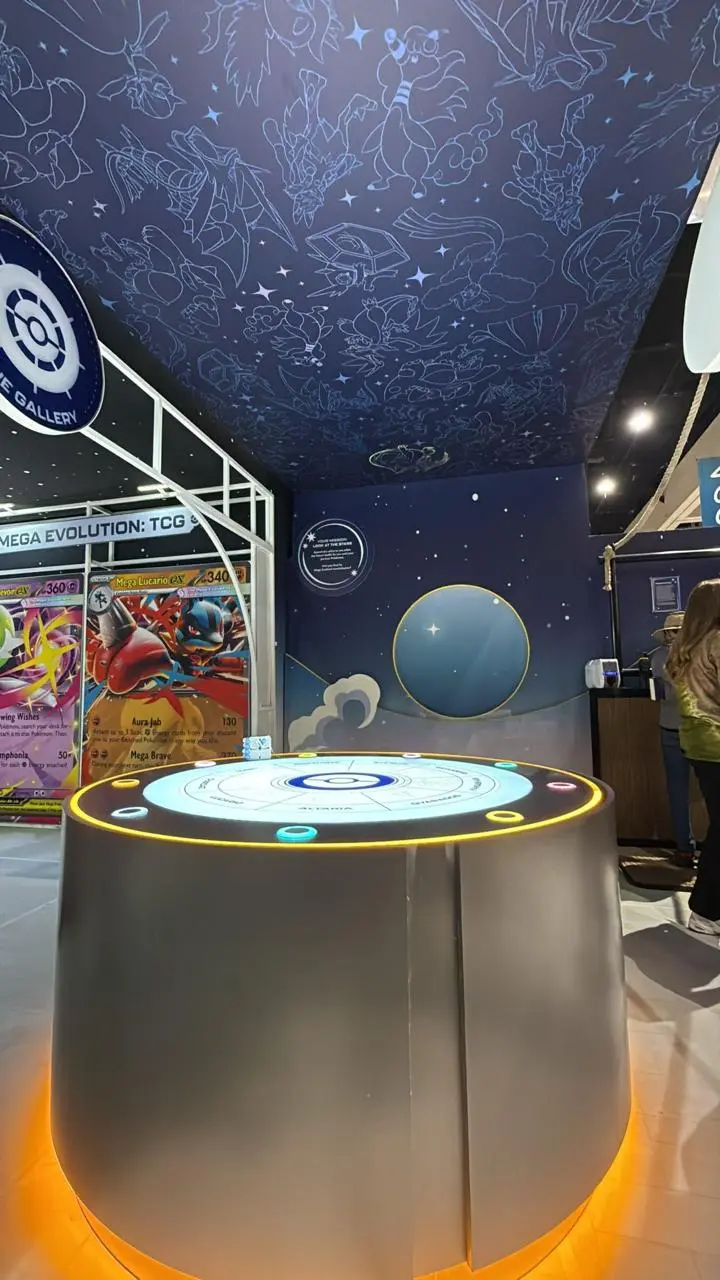 Raspberry Pi interactive exhibition installation with illuminated pedestal buttons and overhead light panels