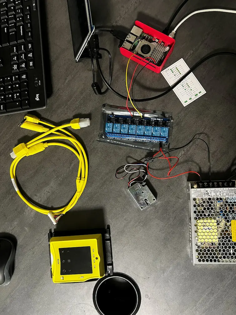 Raspberry Pi 5 smart locker bench build — relay board, 12V solenoid lock, Nayax reader, power supply.